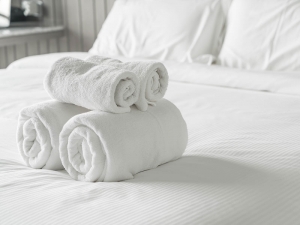 respite-care respite care image with towels rolled up on bed