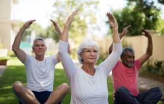 Senior doing excercise in senior living community