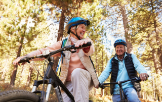 Heritage-Woods-senior-man-and-woman-biking-exercising